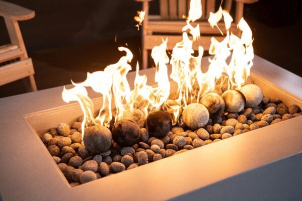 Fire pit with lava pebbles and cannon balls burning