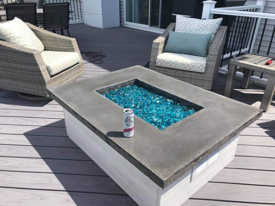 fire table with blue glass and grey top with white sides