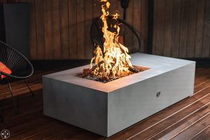 65 inch Acadia fire pit table in Silver Nickel with steel logs