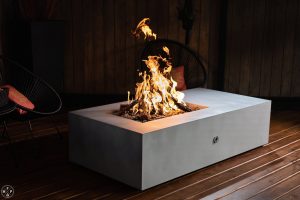 65 inch Acadia fire pit table in Silver Nickel with steel logs