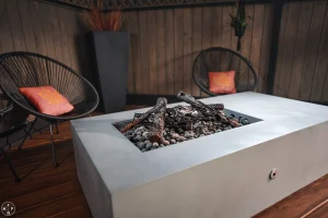 65 inch Acadia fire pit table in Silver Nickel with steel logs