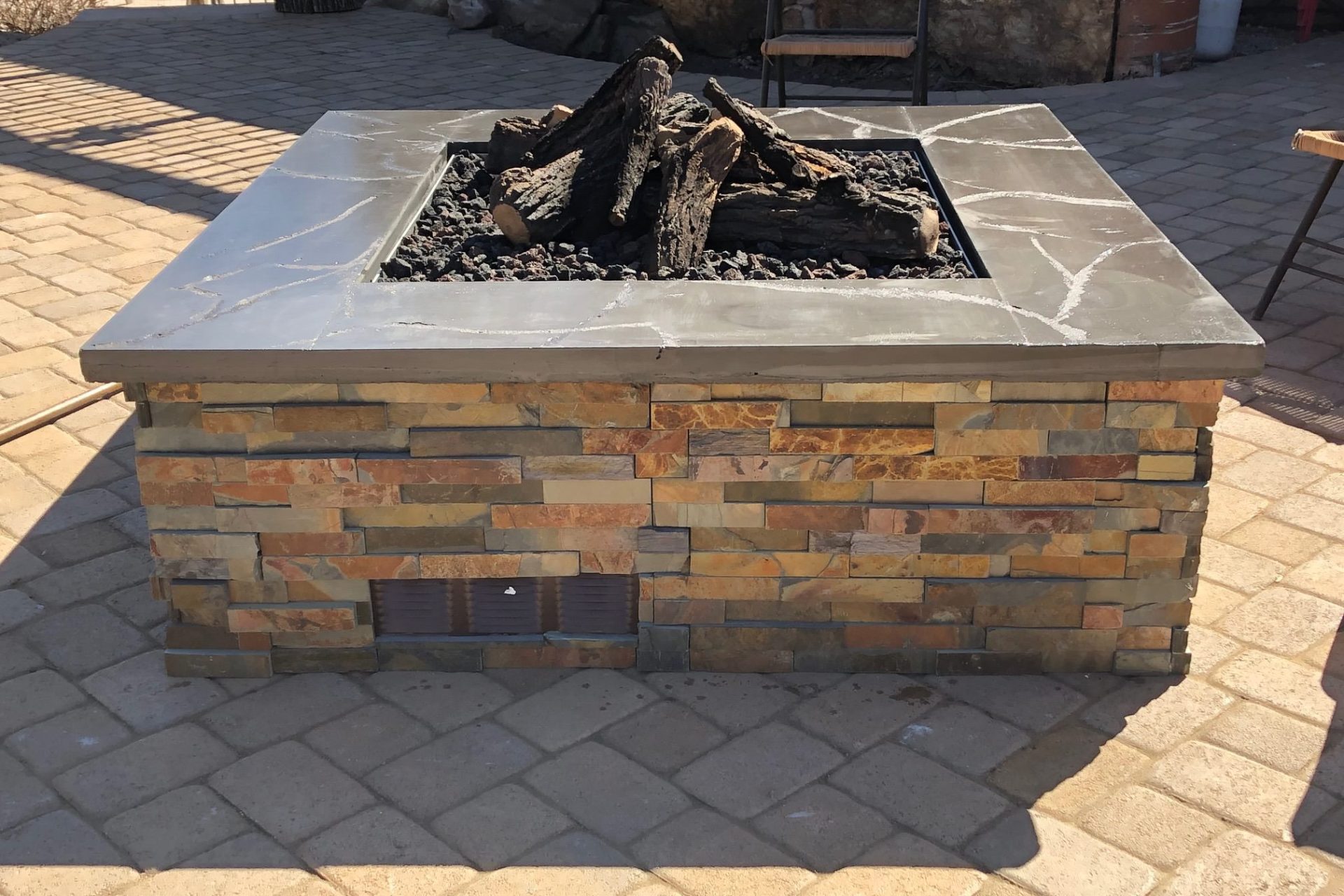 stone fire pit not lit with logs